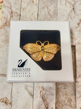 Vintage retired Swarovski pave butterfly brooch pin.